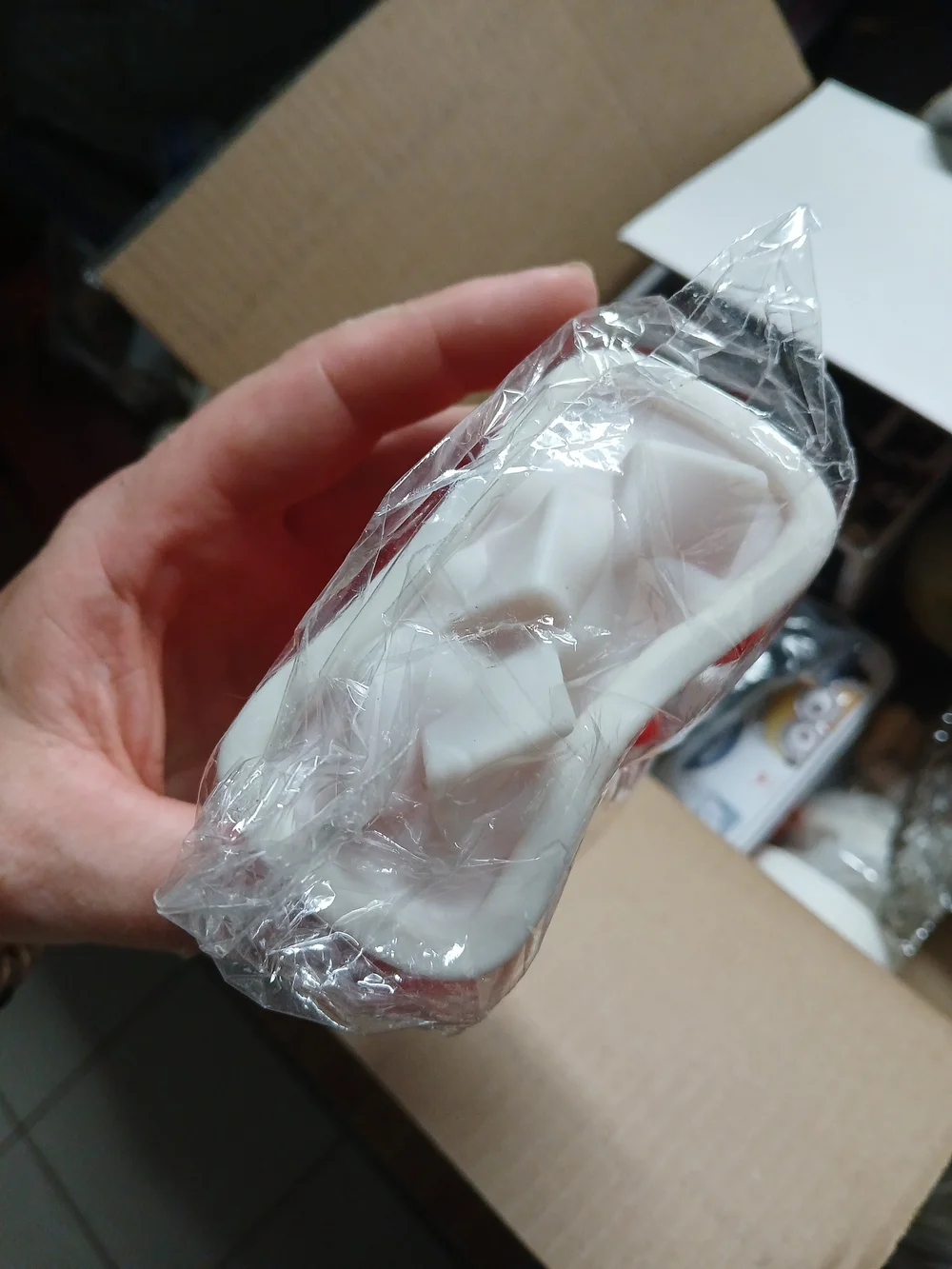a Soda Clicker fidget toy or a similar 3D-printed accessory.